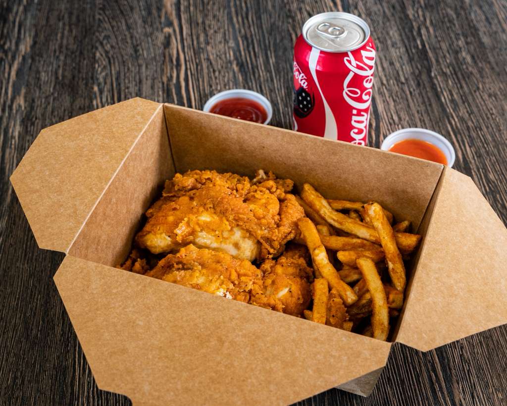 Fried chicken and fries in a kraft box with Coca-Cola and dipping sauces